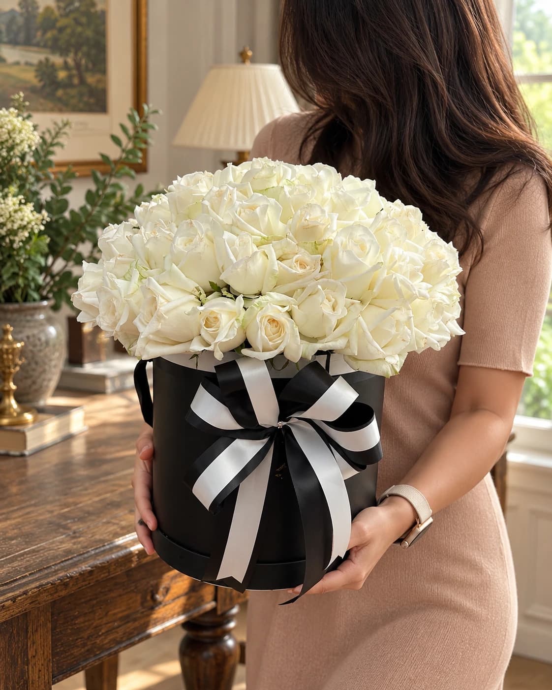 Elegant White Rose Box with Fresh white roses, Silver ribbon, circular black box with a lid.