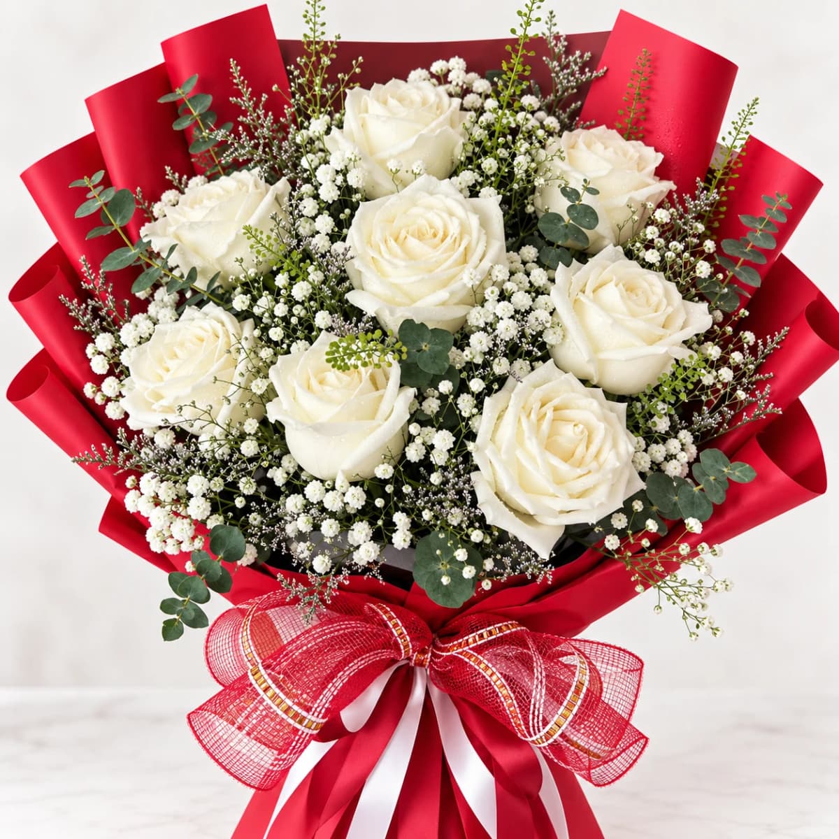 Elegant white rose bouquet with baby's breath, perfect for special occasions.